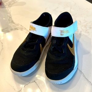 Nike boys, black, gold & white shoes